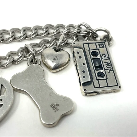 JAMES AVERY sterling silver charm bracelet, 8 charms Bracelets